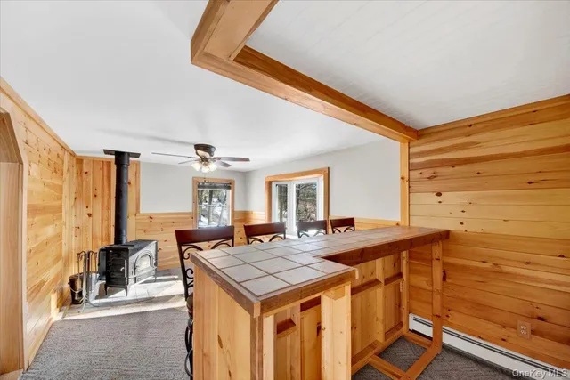 a view of a dining room with furniture and window