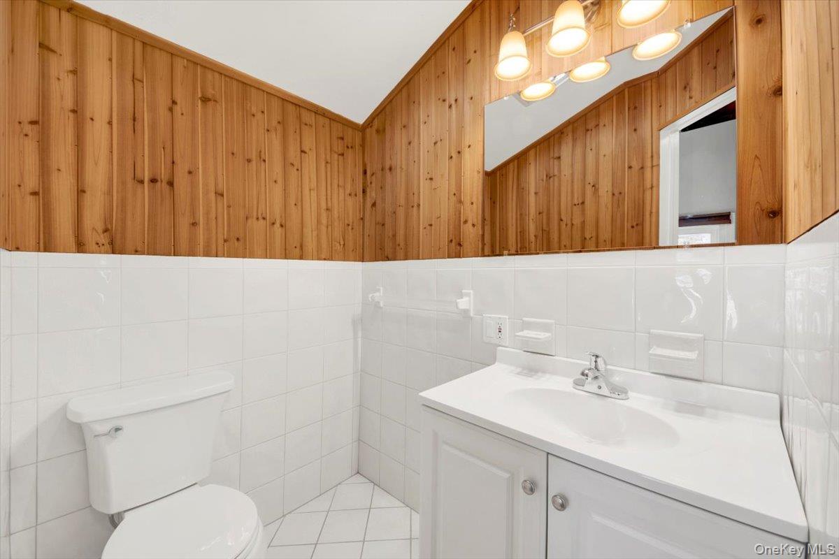 3843 Perry Street Jefferson Valley, NY 10535 - Photo 25 of 36 a bathroom with a sink a toilet and shower