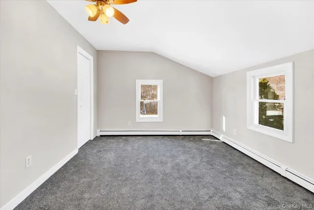 a view of a backyard with sitting area