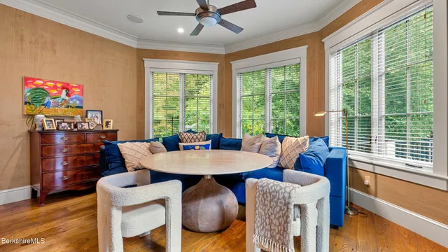 a view of a dining room with furniture window and wooden floor
