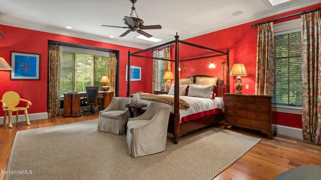 a bedroom with a bed and a lamp