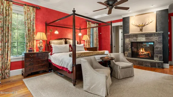 a bedroom with a bed and a couch