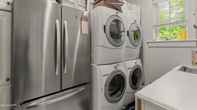 a bed sitting in a room next to a window