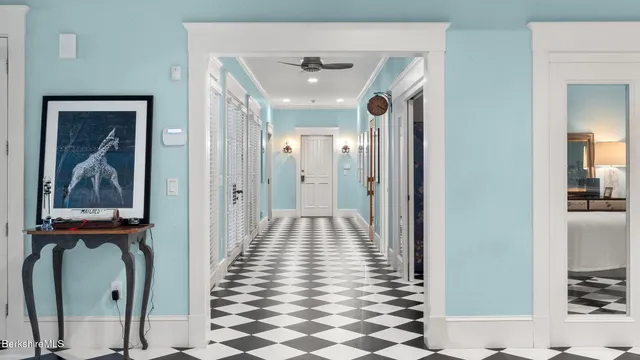 a room with furniture a rug and a window