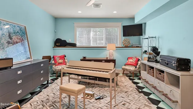 a view of a patio with table and chairs with wooden floor and fence