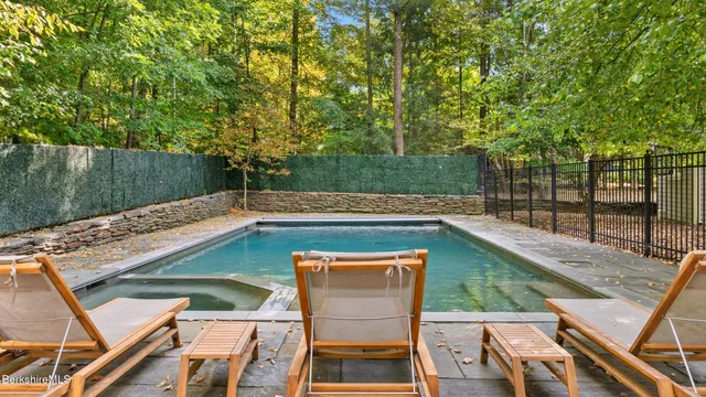 a view of a lush green hillside and a houses