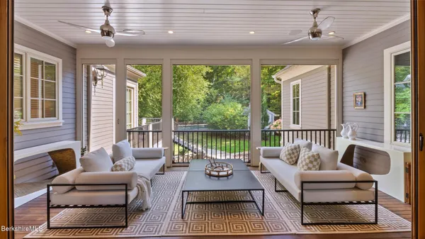 a large kitchen with stainless steel appliances granite countertop a stove and a refrigerator