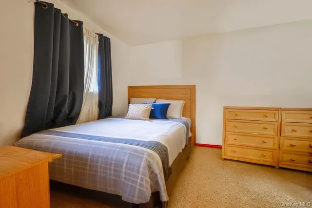 a bedroom with a bed and a closet