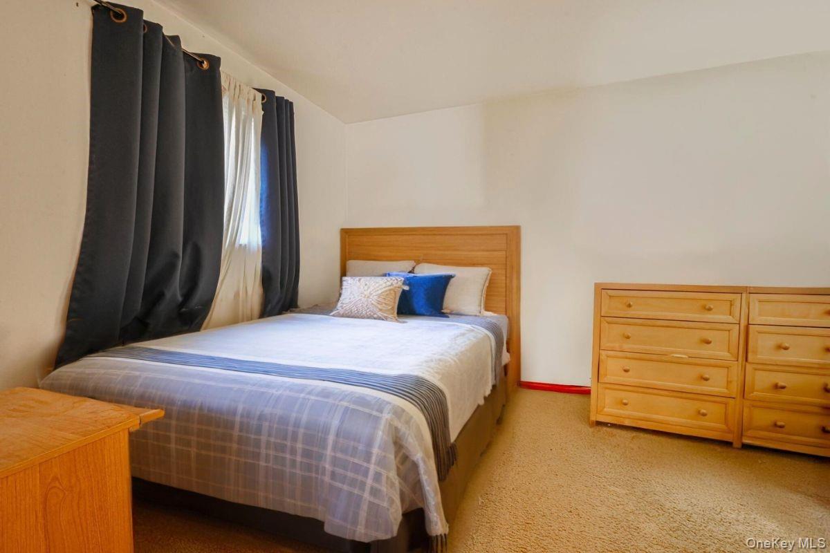 3 Healy Street Huntington, NY 11743 - Photo 15 of 20 a bedroom with a bed and a closet