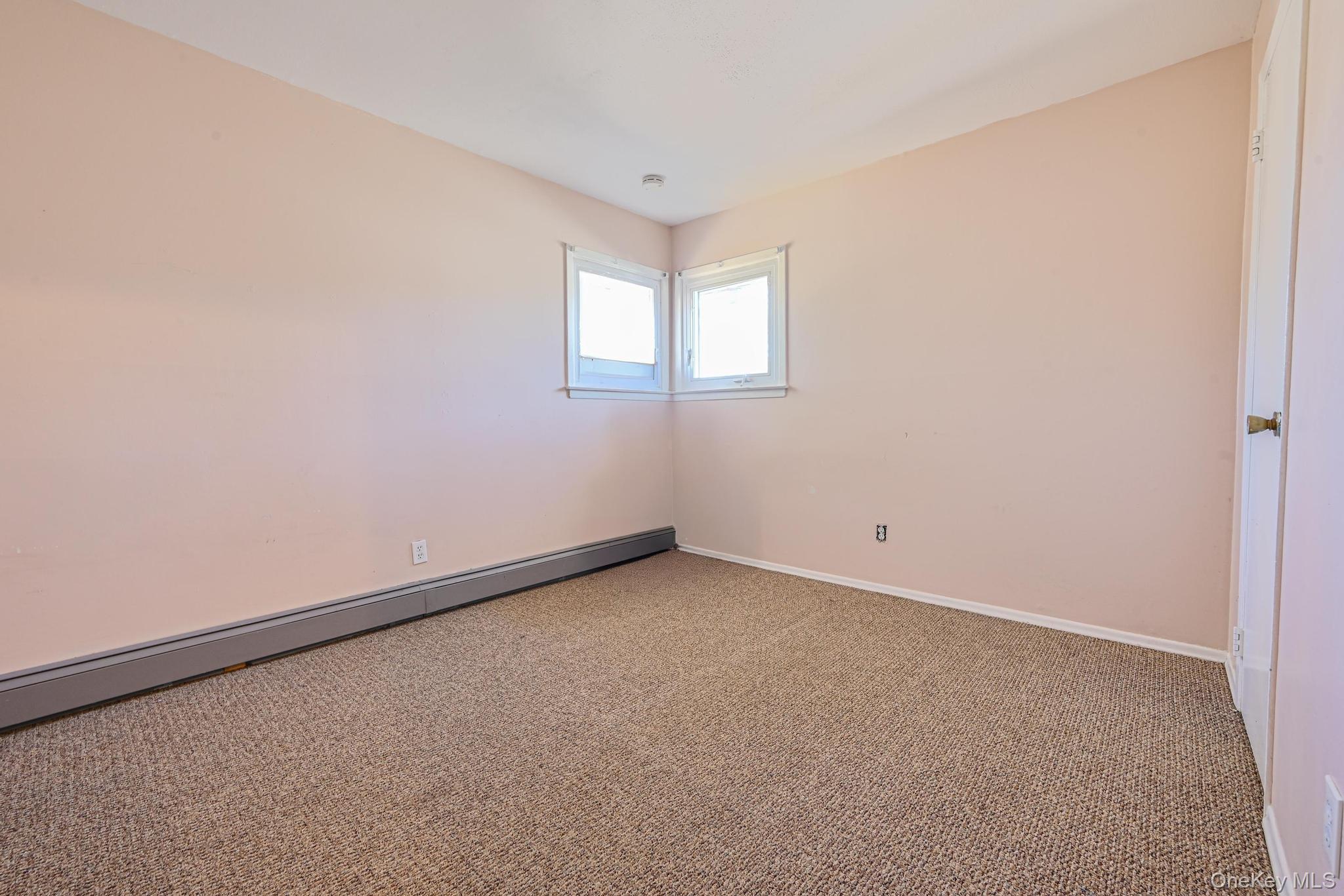 3 Healy Street Huntington, NY 11743 - Photo 9 of 20 a view of an empty room with a window