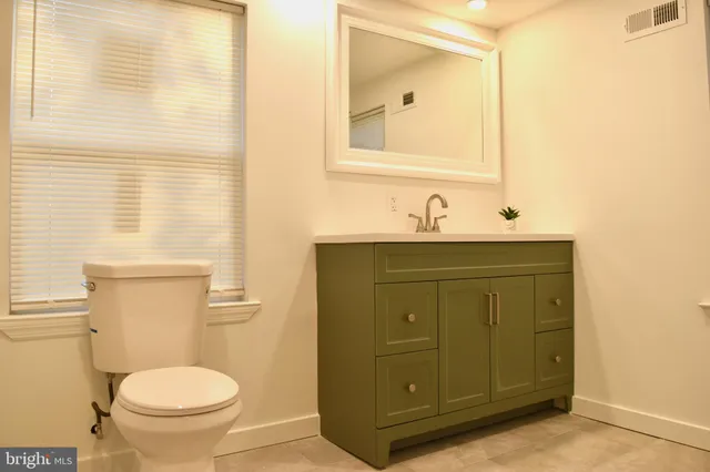 a bathroom with a sink and a toilet