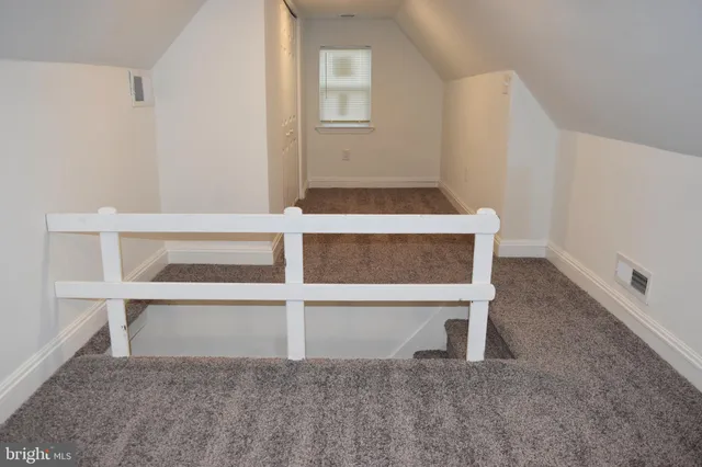a view of wooden floor and chair in a room