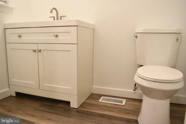 a bathroom with a toilet and a sink