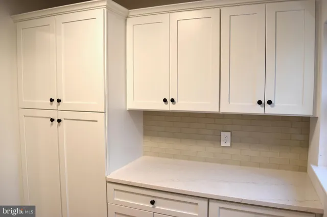 a view of cabinets and wooden floor