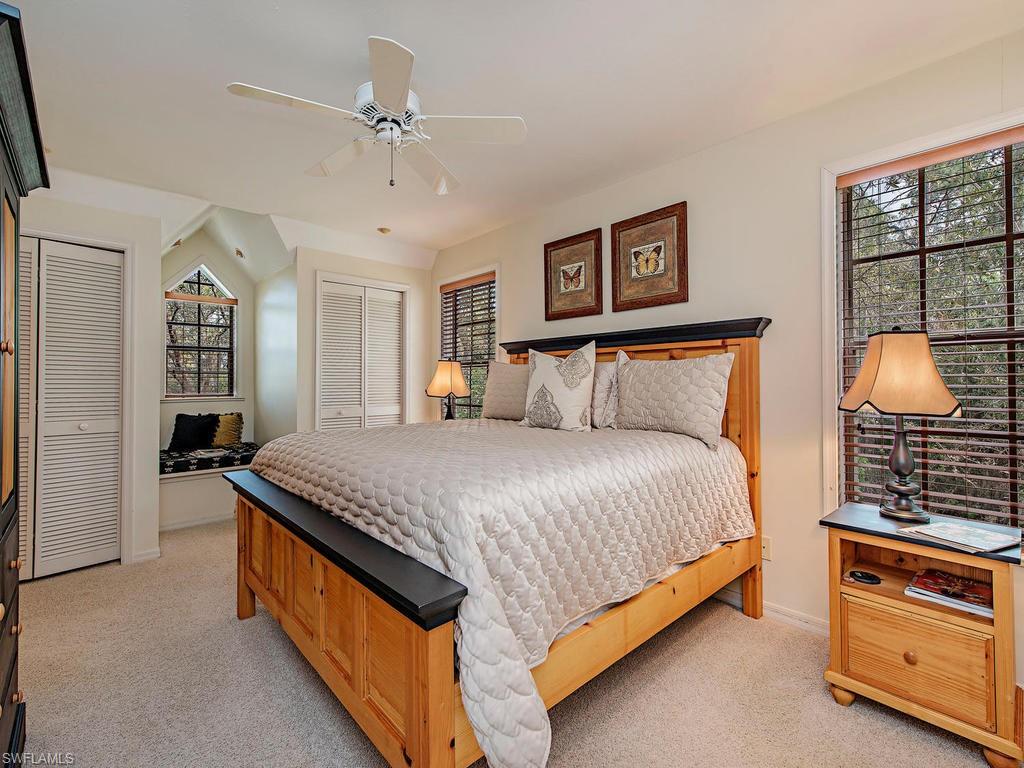 6470 Daniels Road Naples, FL 34109 - Photo 16 of 22 a spacious bedroom with a bed and a dresser