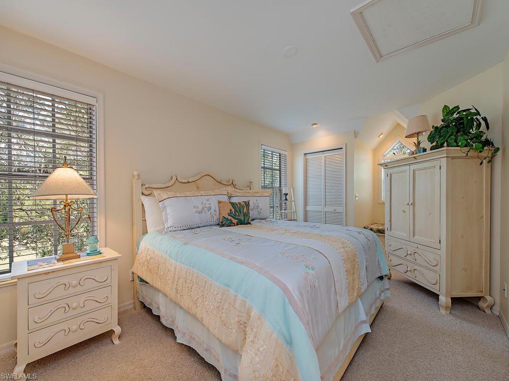 6470 Daniels Road Naples, FL 34109 - Photo 18 of 22 a bedroom with bed and window