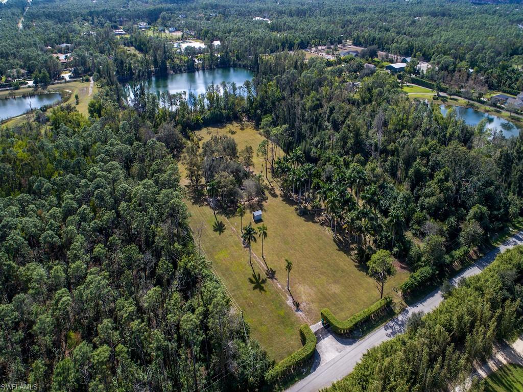 6470 Daniels Road Naples, FL 34109 - Photo 2 of 22 an aerial view of city and lake view