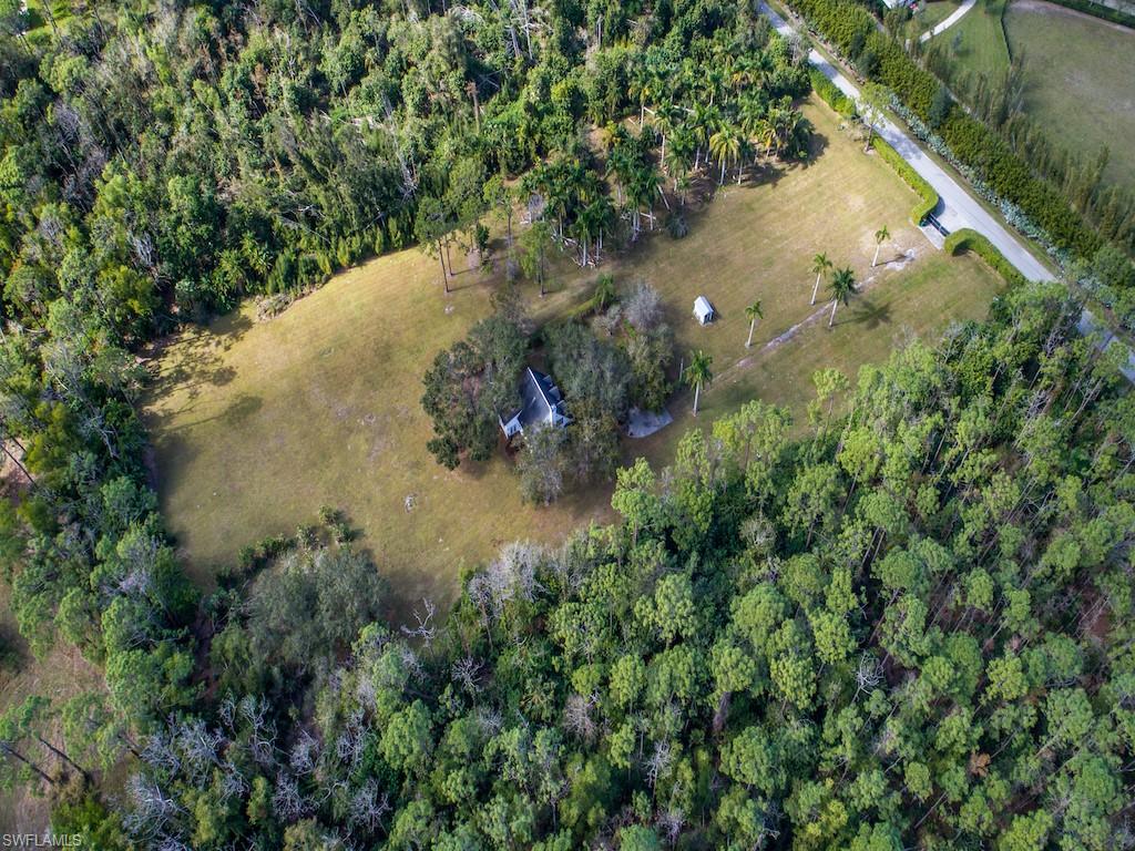 6470 Daniels Road Naples, FL 34109 - Photo 6 of 22 a view of a lake and green space