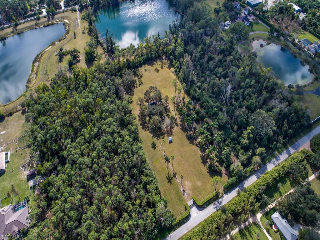 6470 Daniels Road Naples, FL 34109 - Photo 9 of 22 an aerial view of lake houses with outdoor space and trees all around