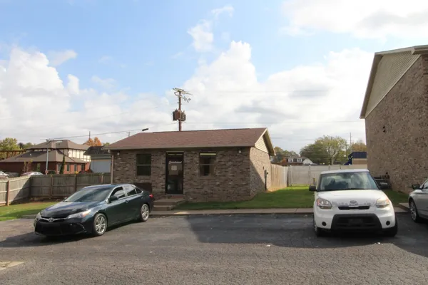 a car parked in front of a house