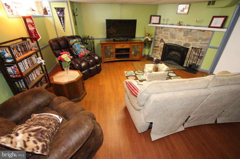 1843 Deveron Road Baltimore, MD 21286 - Photo 21 of 30 a living room with furniture and a fireplace