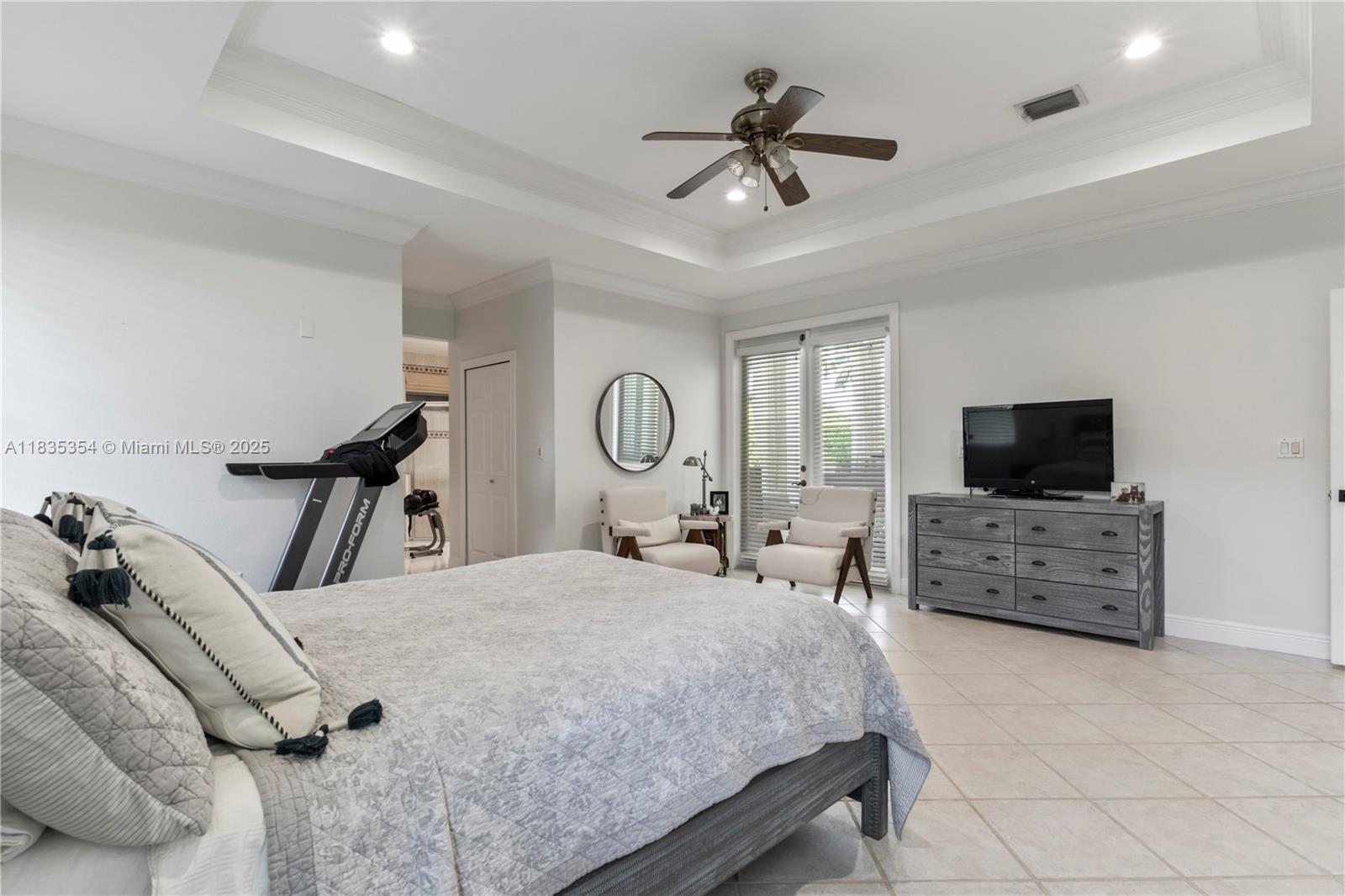 12530 Southwest 96th Court Miami, FL 33176 - Photo 11 of 21 a bed room with a bed a television and dresser