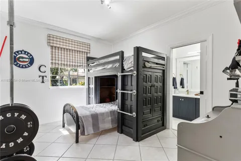 a bedroom with furniture and a window