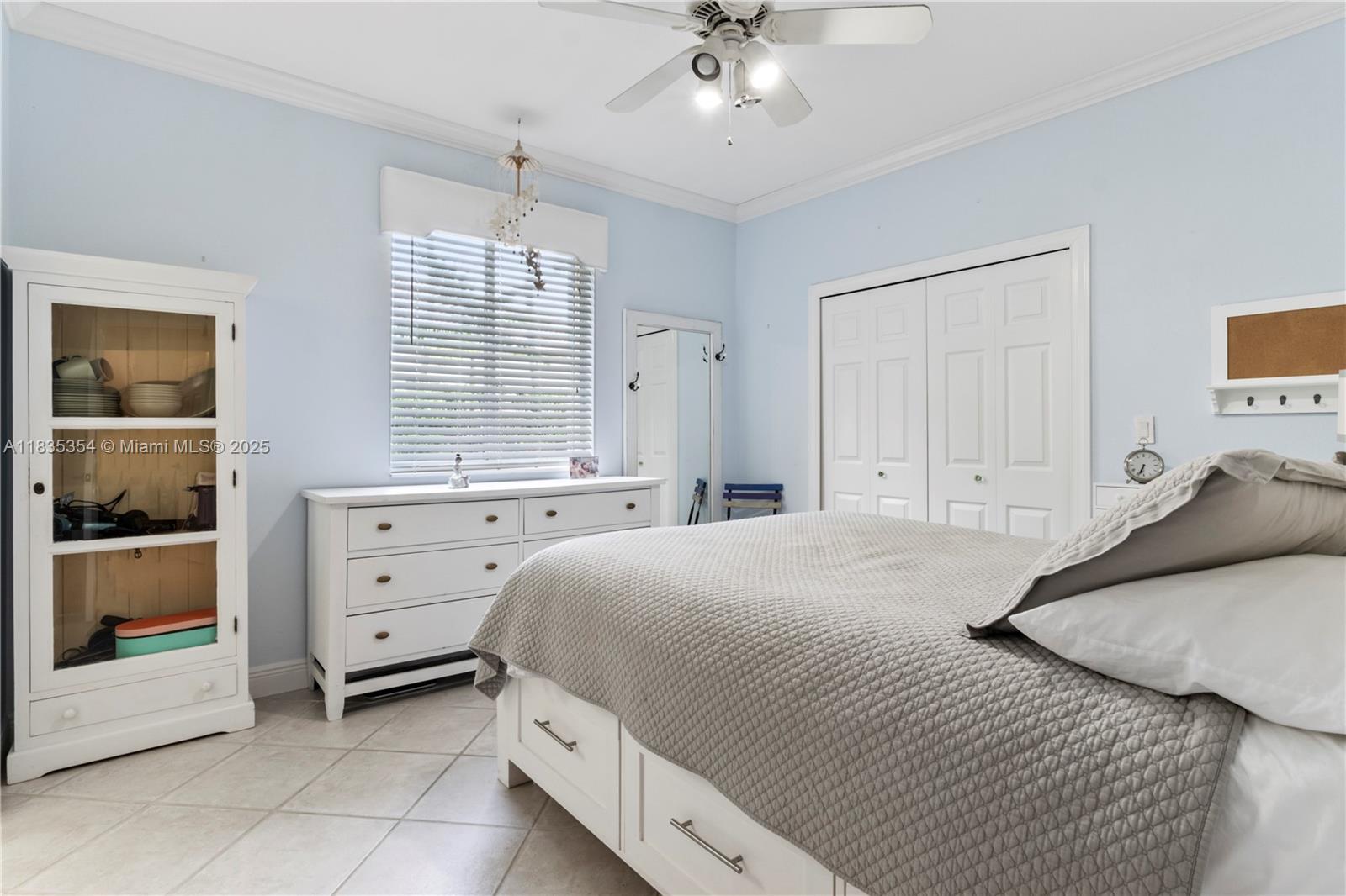 12530 Southwest 96th Court Miami, FL 33176 - Photo 18 of 21 a bedroom with a bed and a dresser