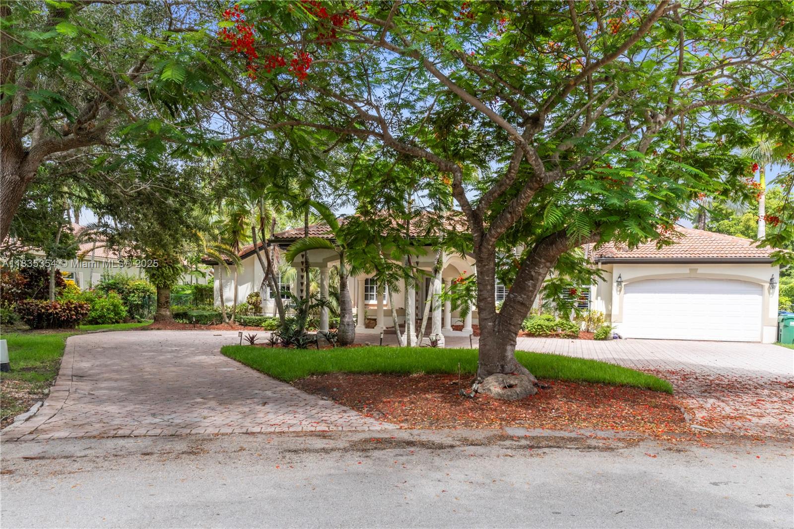 12530 Southwest 96th Court Miami, FL 33176 - Photo 21 of 21 a pathway of a house with a yard and large tree
