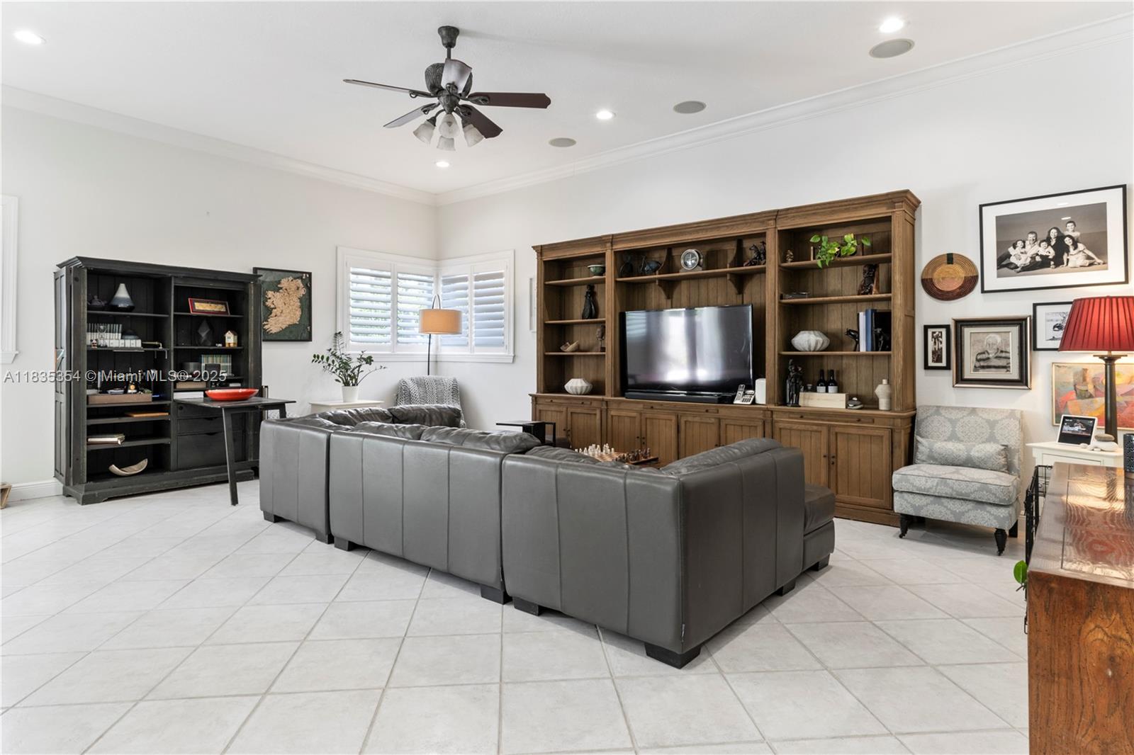 12530 Southwest 96th Court Miami, FL 33176 - Photo 7 of 21 a living room with furniture and a flat screen tv