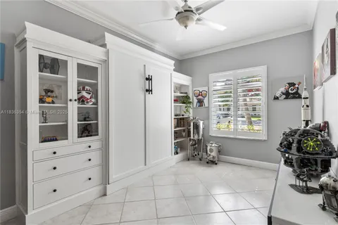 a view of room with cabinet and a large window