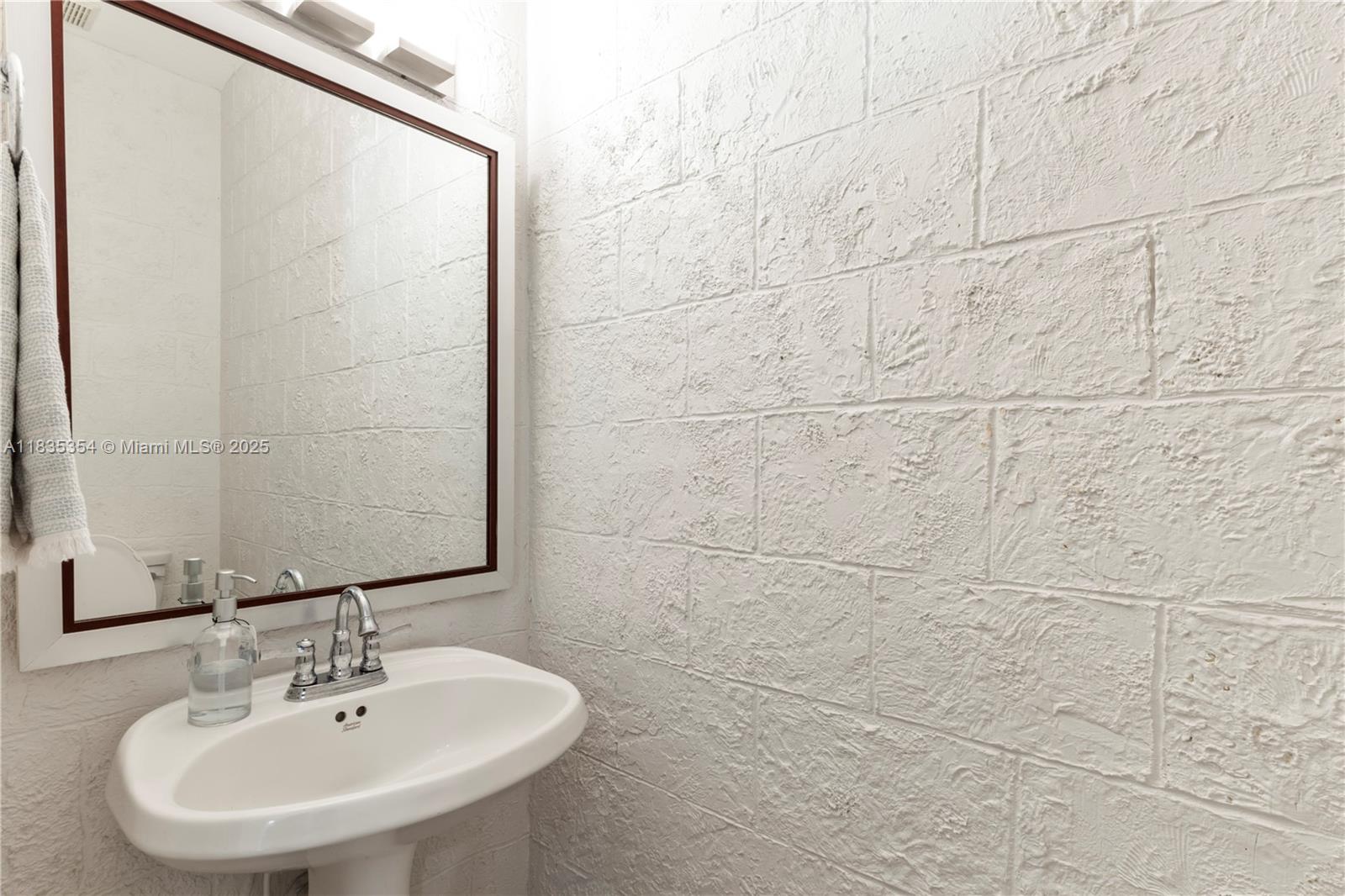 12530 Southwest 96th Court Miami, FL 33176 - Photo 9 of 21 a bathroom with a sink and a mirror