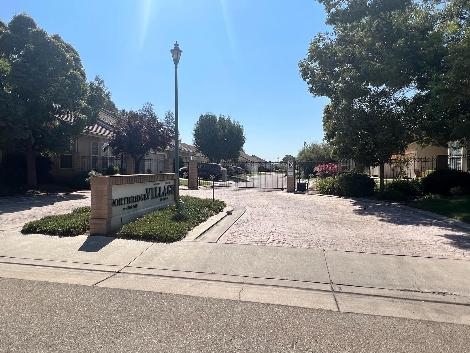 Undisclosed Address Dinuba, CA 93618 - Photo 2 of 45 a view of street with houses