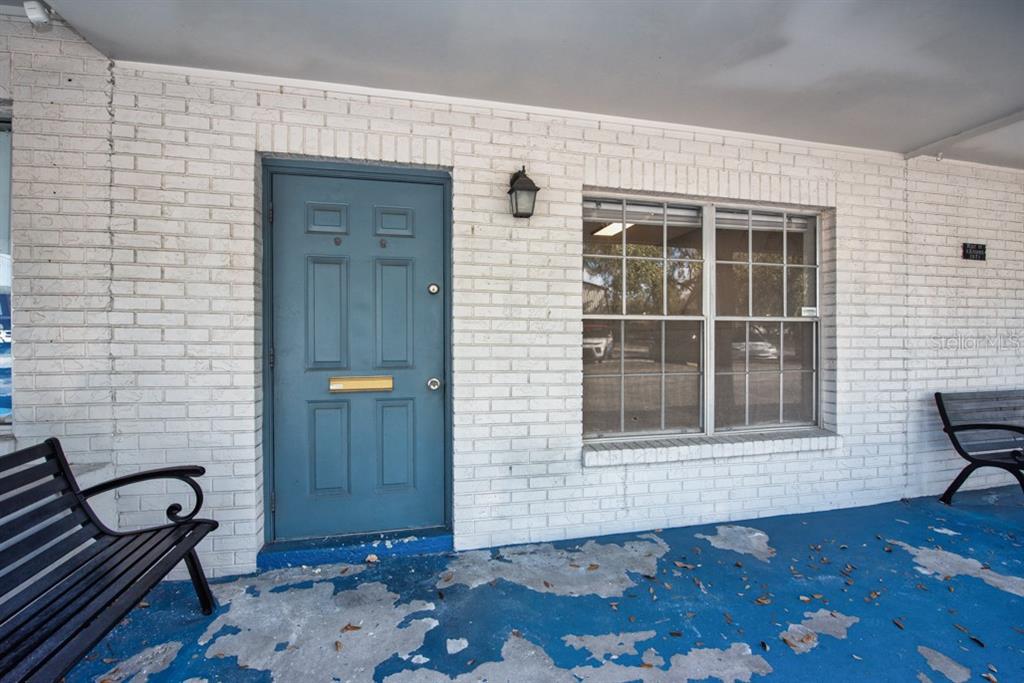 7410 Commerce Street, Unit 101 Riverview, FL 33578 - Photo 3 of 25 a view of a door and a chair in a room