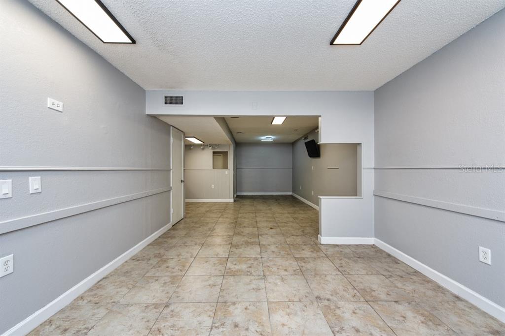 7410 Commerce Street, Unit 101 Riverview, FL 33578 - Photo 6 of 25 a view of a hallway with a kitchen