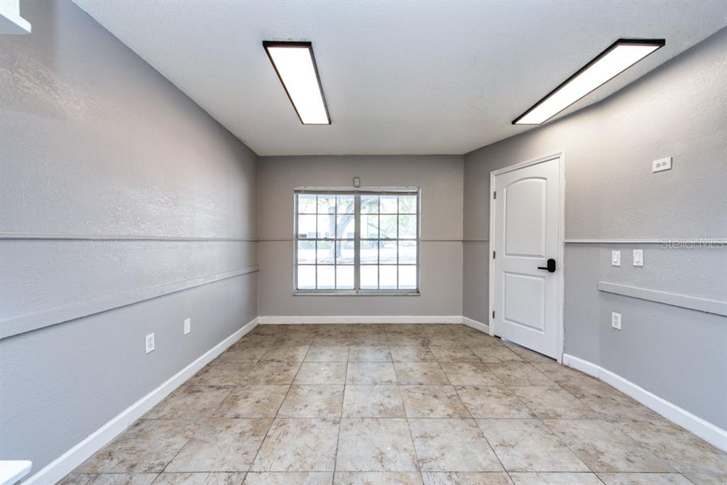 7410 Commerce Street, Unit 101 Riverview, FL 33578 - Photo 7 of 25 a view of empty room with a window
