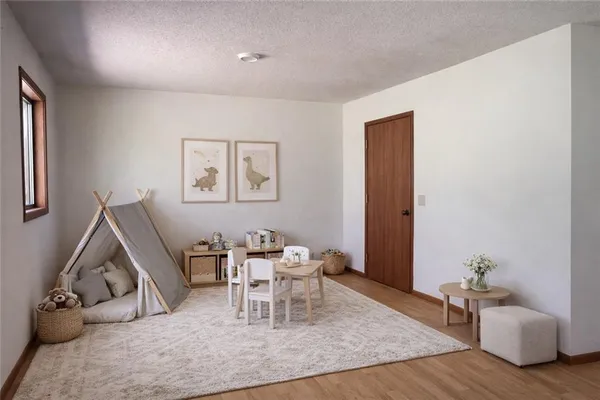 a living room with furniture rug and window
