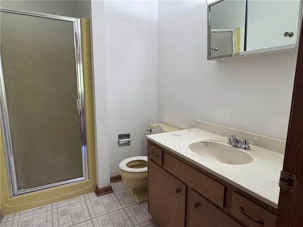 a bathroom with a sink toilet and vanity