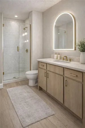 a spacious bathroom with a double vanity sink mirror and toilet