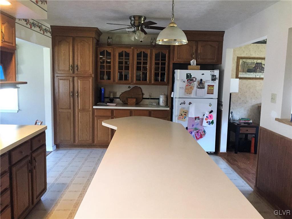 1195 Smith Gap Road Bath, PA 18014 - Photo 4 of 18 a kitchen with a refrigerator and a stove top oven