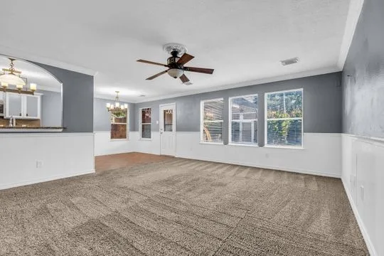 a view of an empty room with a window