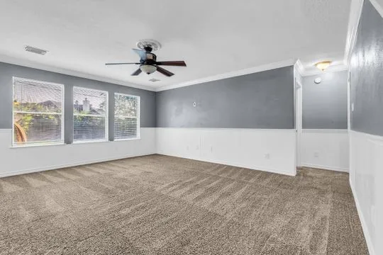 a view of an empty room with a window