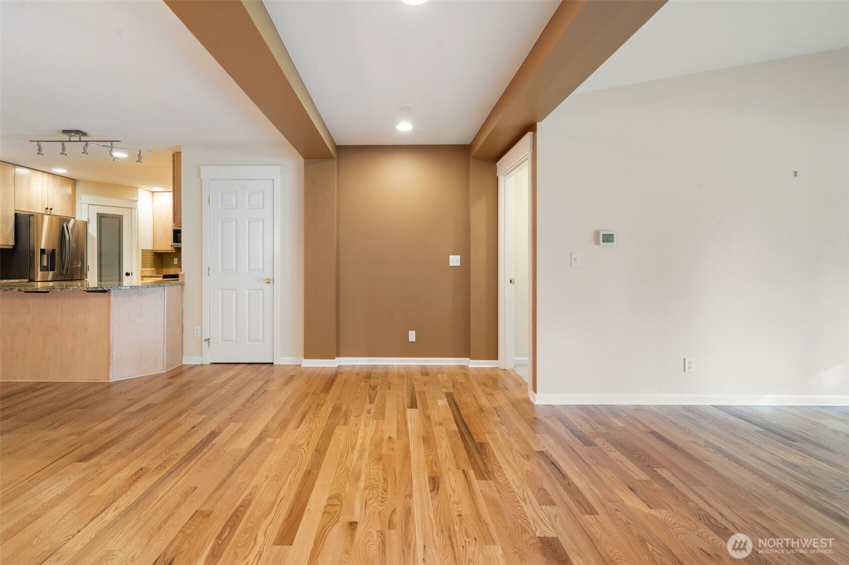 321 East Soderberg Road, Unit D12 Allyn, WA 98524 - Photo 11 of 37 a view of a livingroom with wooden floor and a bathroom