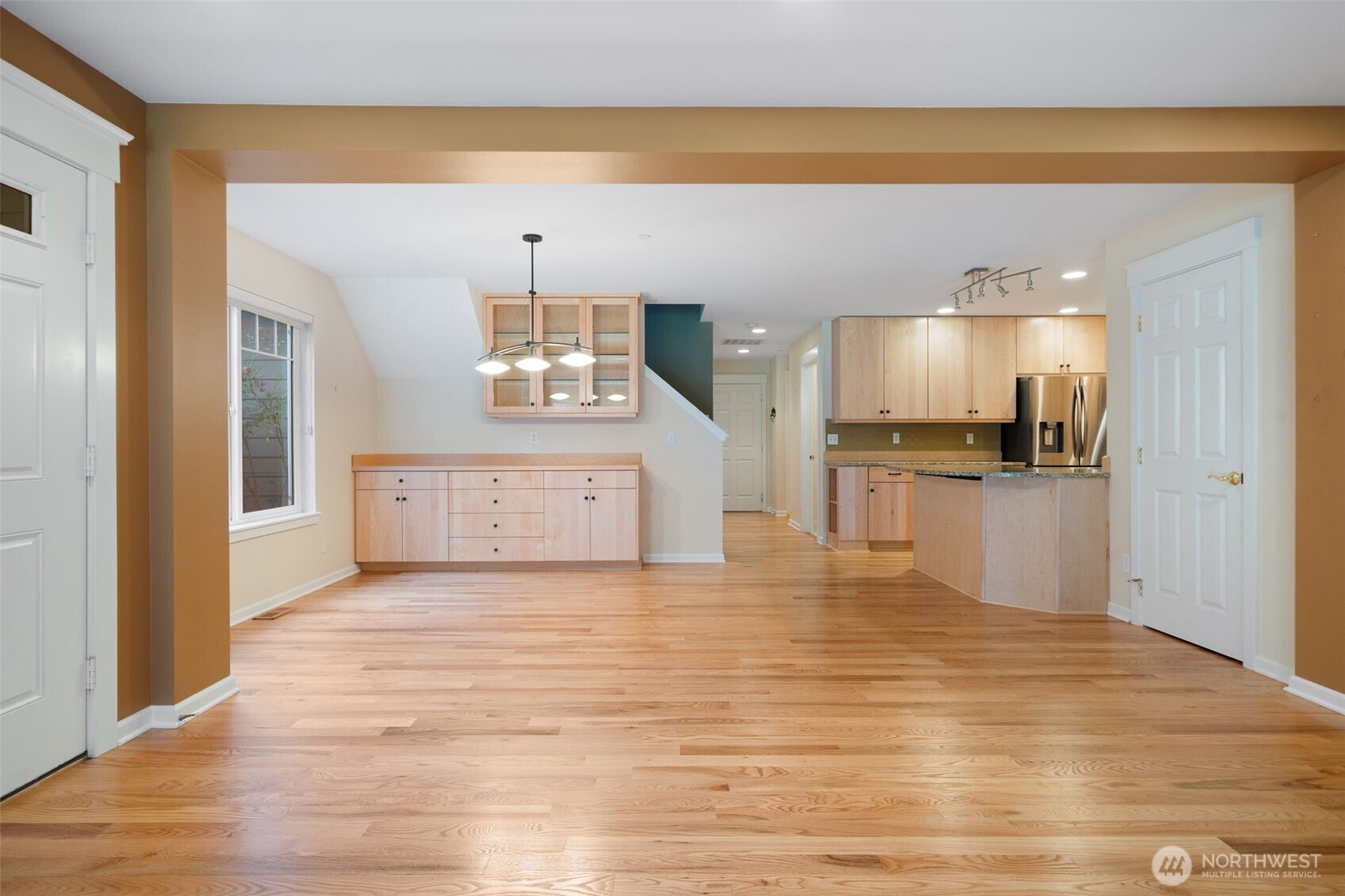 321 East Soderberg Road, Unit D12 Allyn, WA 98524 - Photo 13 of 37 a view of a kitchen with kitchen island white cabinets and stainless steel appliances