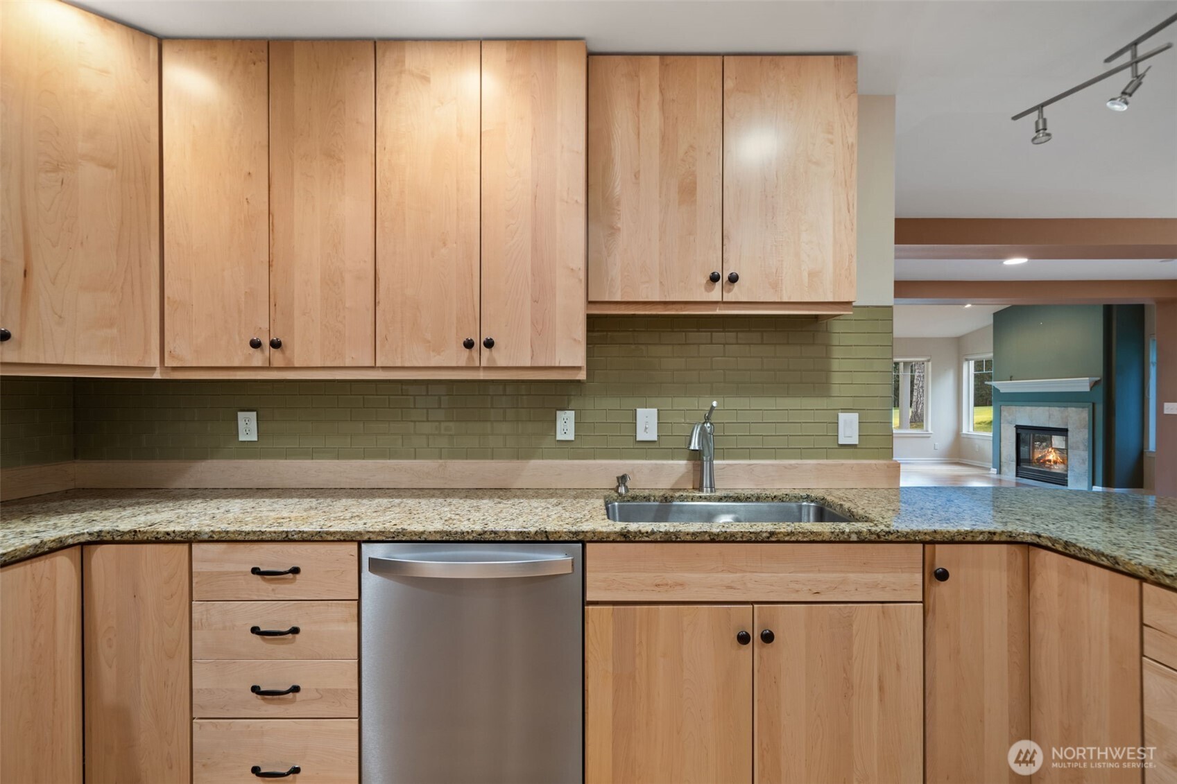 321 East Soderberg Road, Unit D12 Allyn, WA 98524 - Photo 19 of 37 a kitchen with granite countertop cabinets and white appliances
