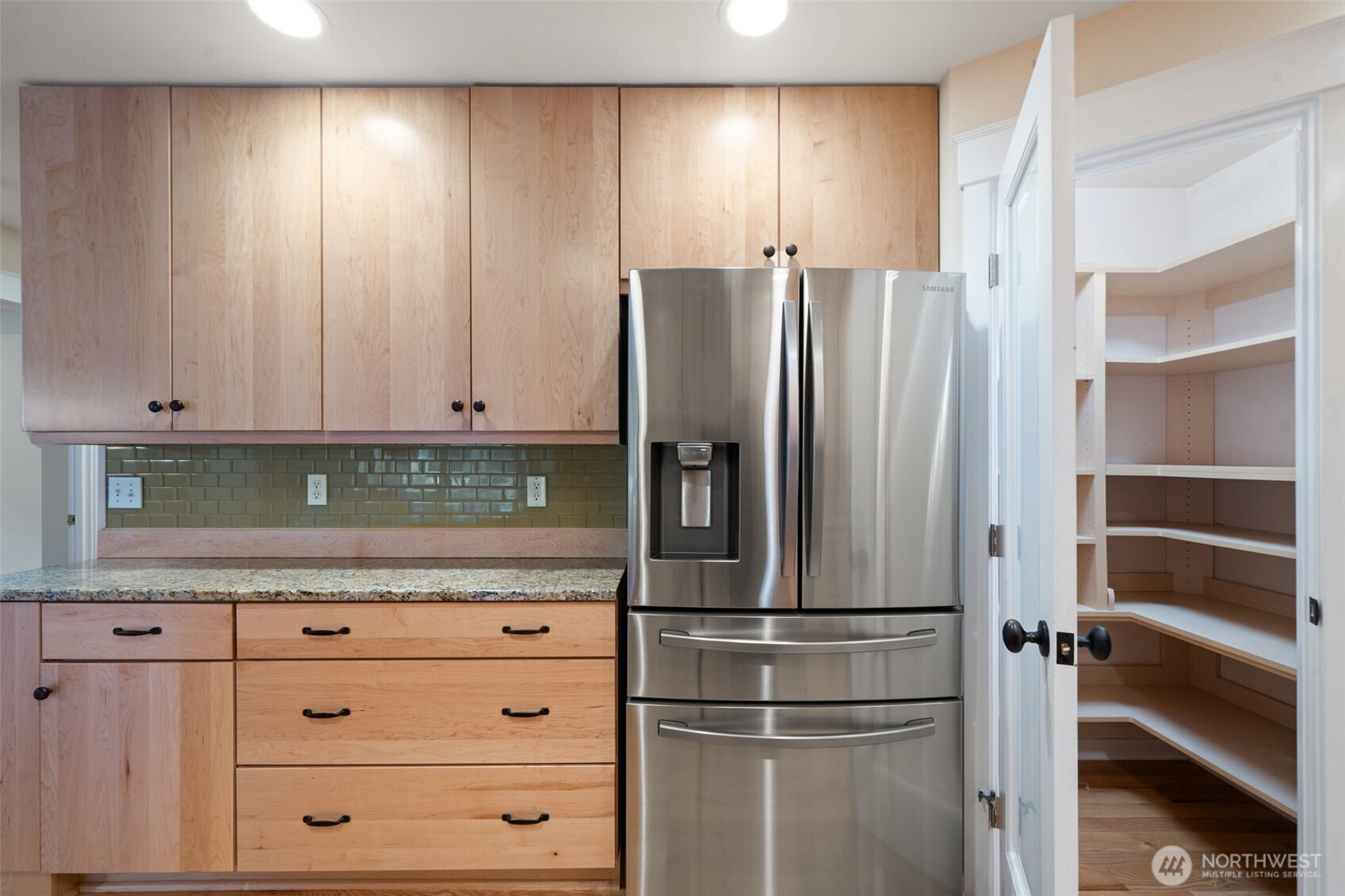 321 East Soderberg Road, Unit D12 Allyn, WA 98524 - Photo 20 of 37 a kitchen with stainless steel appliances granite countertop a refrigerator and cabinets