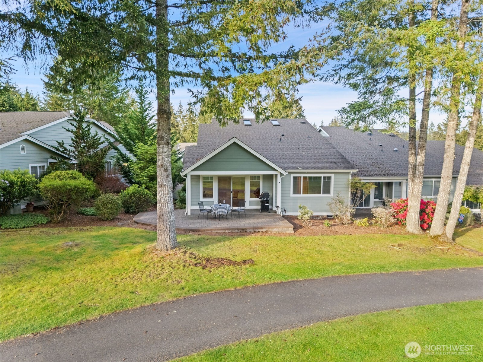 321 East Soderberg Road, Unit D12 Allyn, WA 98524 - Photo 35 of 37 a front view of a house with swimming pool and porch with furniture