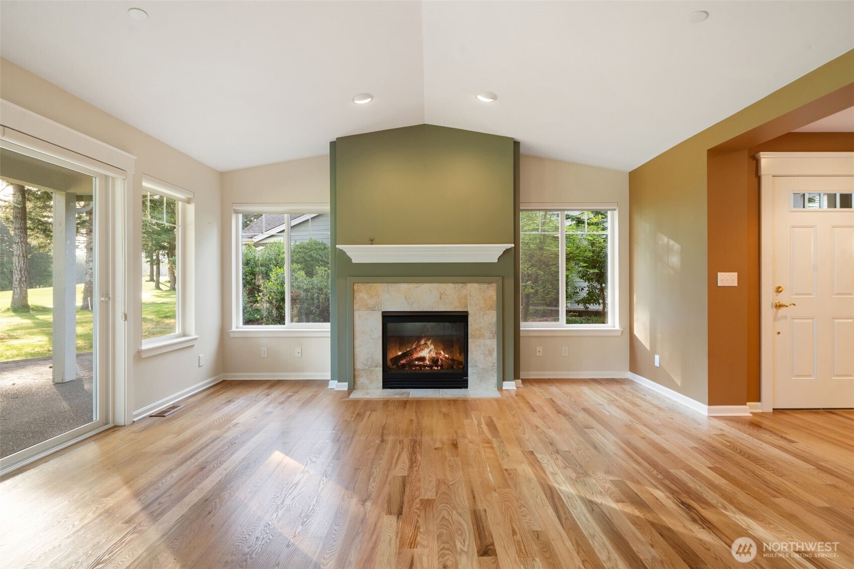 321 East Soderberg Road, Unit D12 Allyn, WA 98524 - Photo 6 of 37 a view of an empty room with glass door and wooden floor