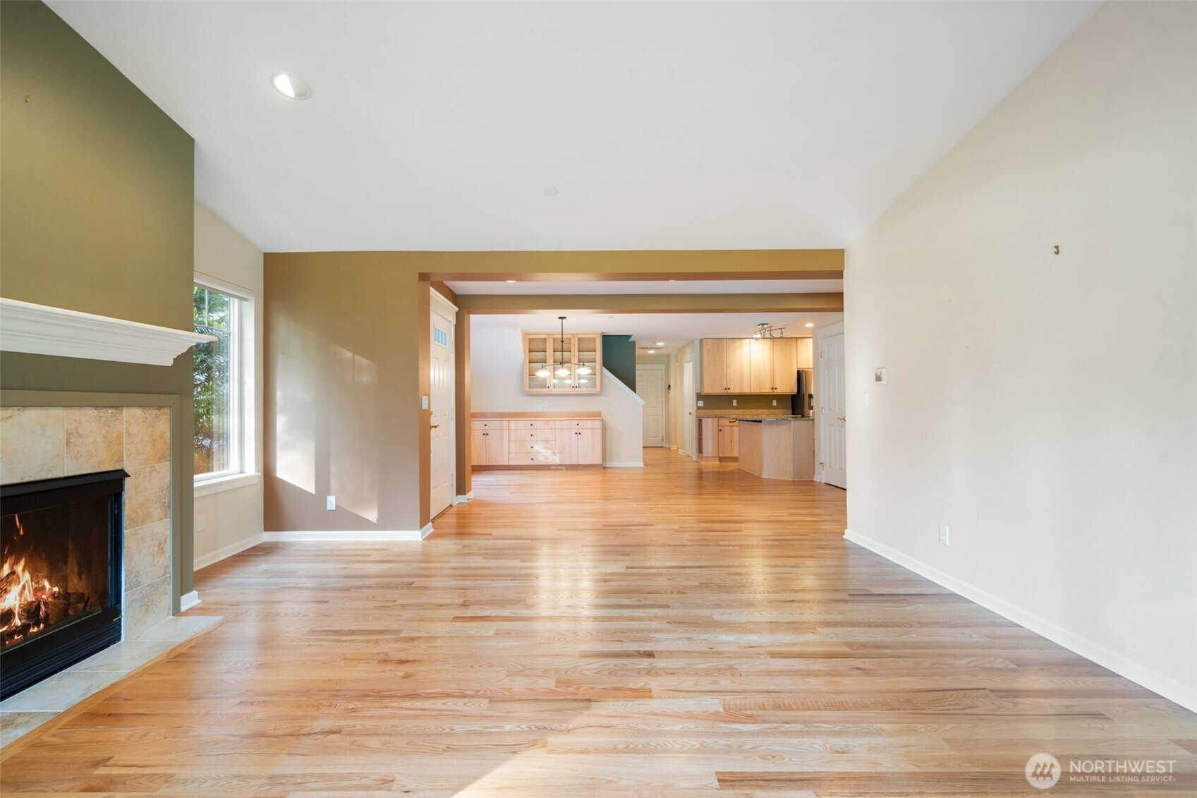 321 East Soderberg Road, Unit D12 Allyn, WA 98524 - Photo 8 of 37 a view of a livingroom with wooden floor and a fireplace