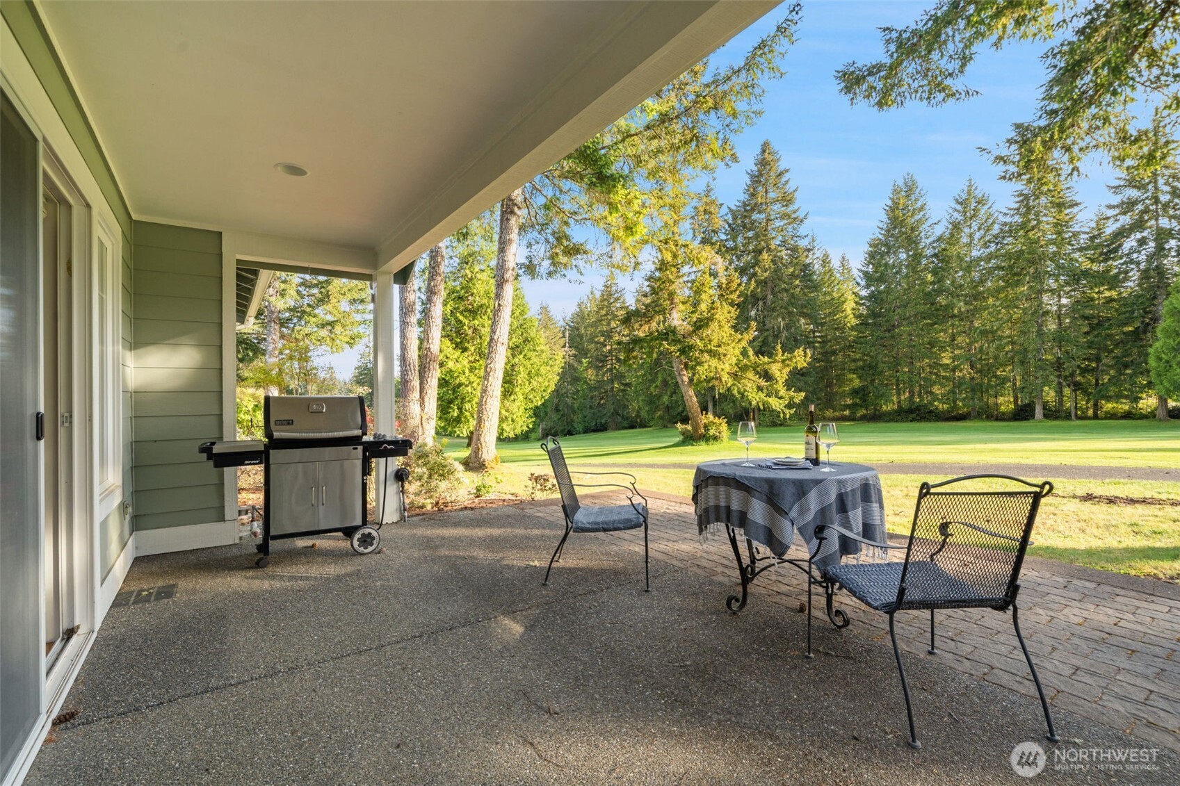 321 East Soderberg Road, Unit D12 Allyn, WA 98524 - Photo 9 of 37 a patio with table and chairs